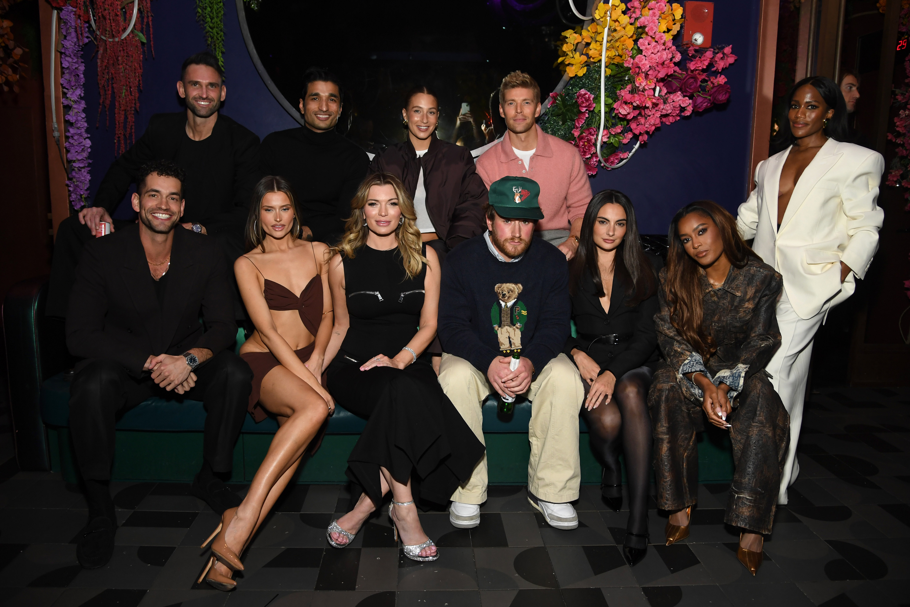 Jesse Solomon, Carl Radke, Lexi Wood, Imrul Hassan, Lindsay Hubbard, Amanda Batula, West Wilson, Kyle Cooke, Paige DeSorbo, Ciara Miller, and Gabby Prescod posing at the Summer House Season 9 premiere party.