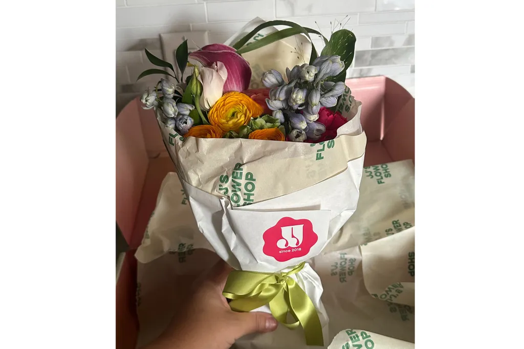 Sophie Cannon holiday a bouquet of flowers.