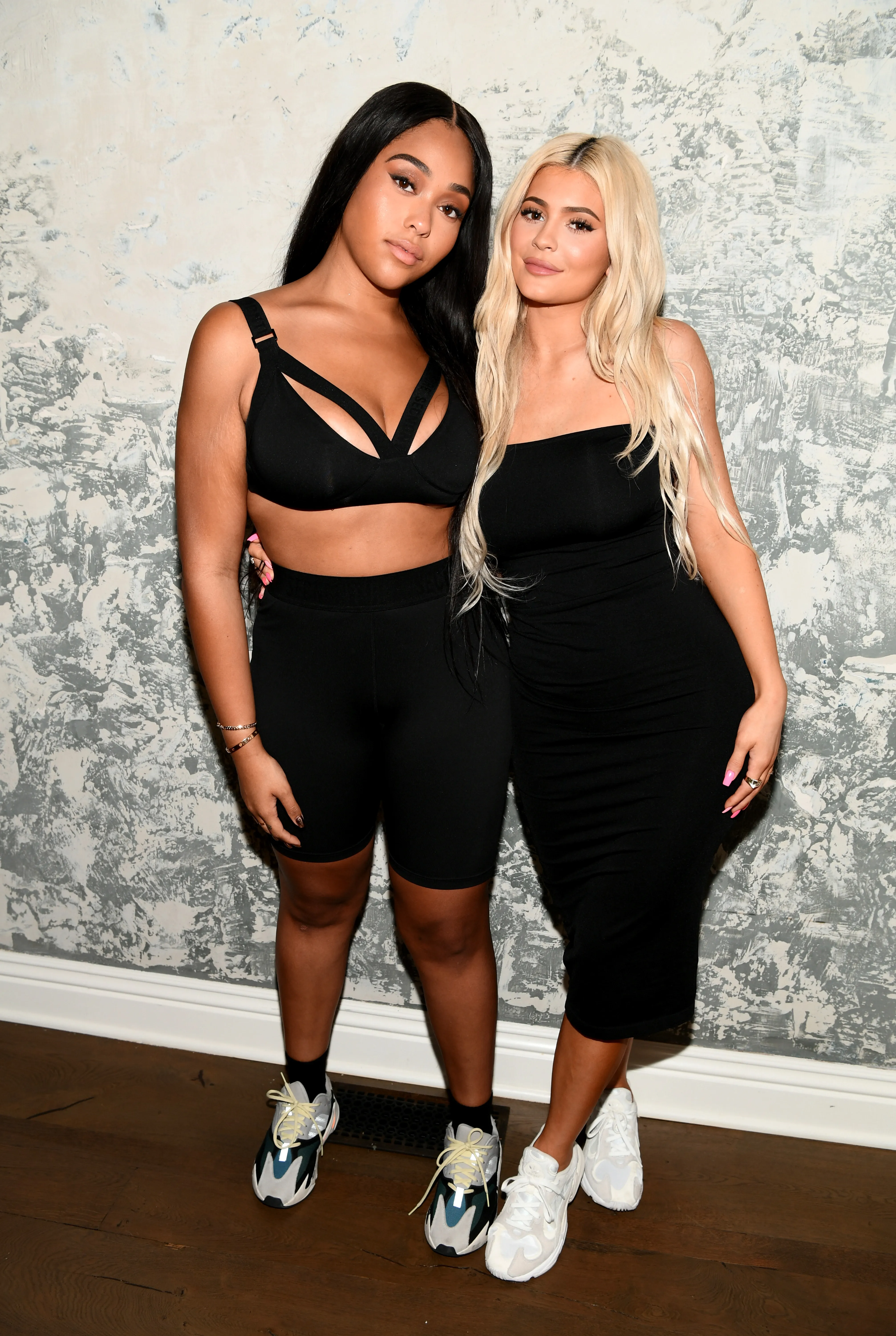 Jordyn Woods and Kylie Jenner posing together at the SECNDNTURE launch event.