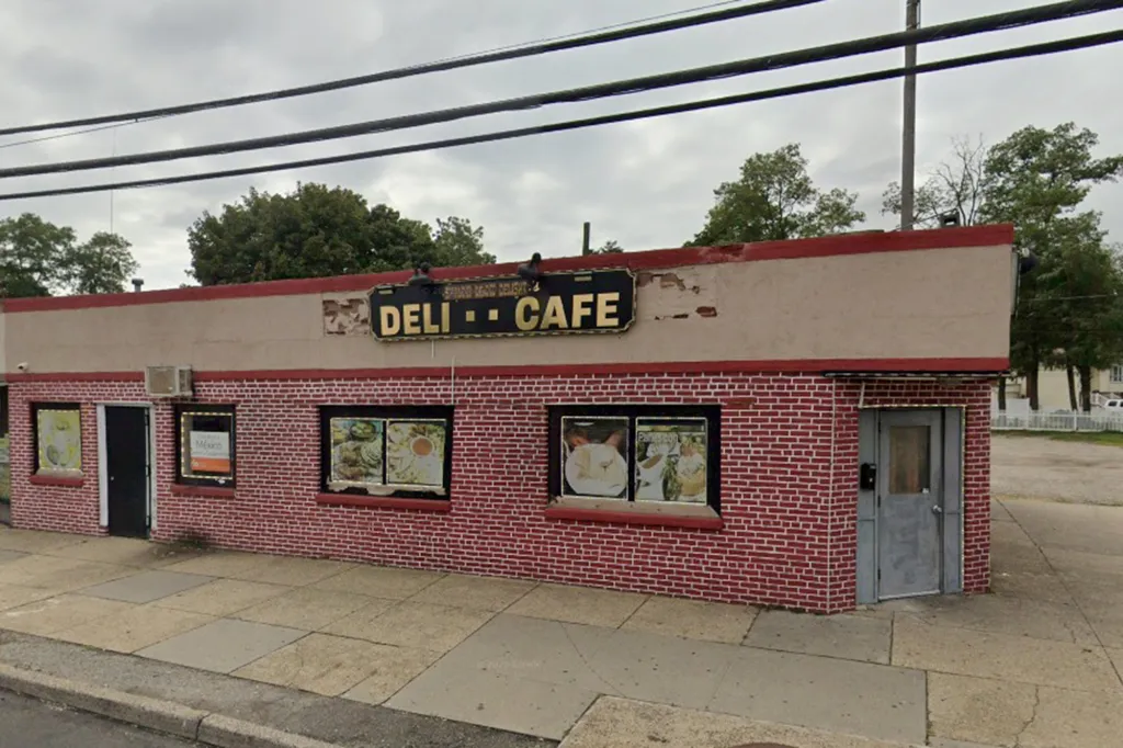 Esperanza Deli Cafe, a red brick building with "Deli -- Cafe" on the sign, in Amityville.