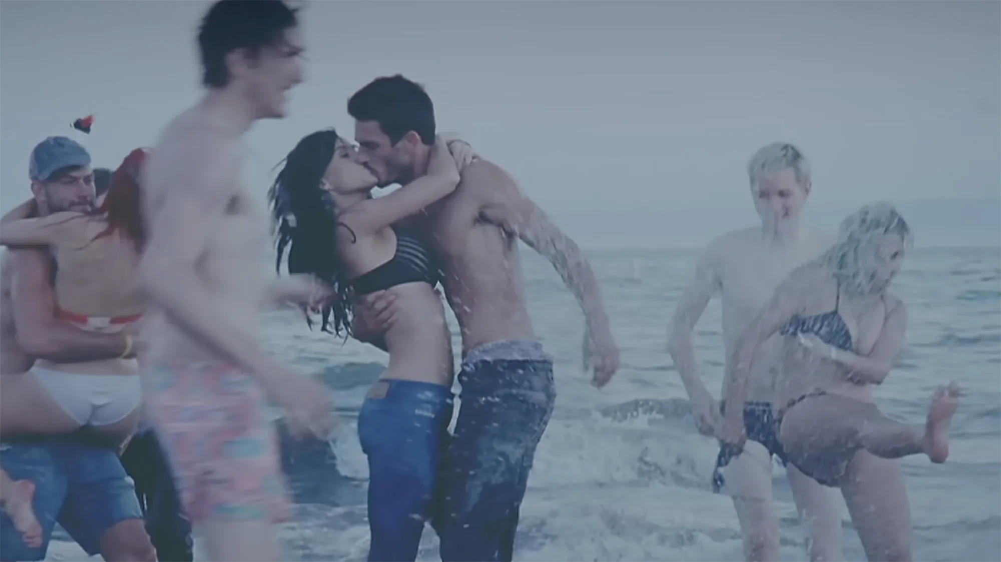 Josh Kloss embracing Katy Perry in the music video for "Teenage Dream."