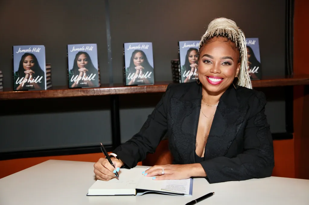 Jemele Hill signs copies of her book "Uphill" at a release party.