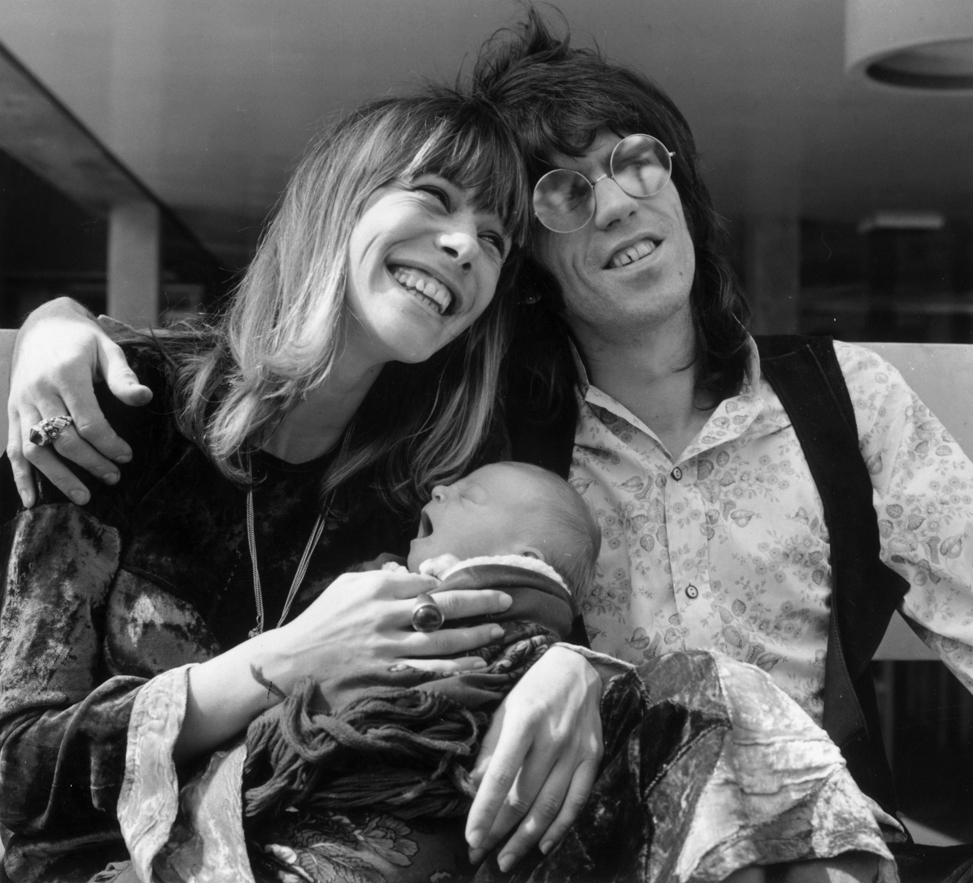 Keith Richards of the Rolling Stones outside King's College Hospital in Dulwich, London, with his wife Anita Pallenberg and their baby son Marlon.