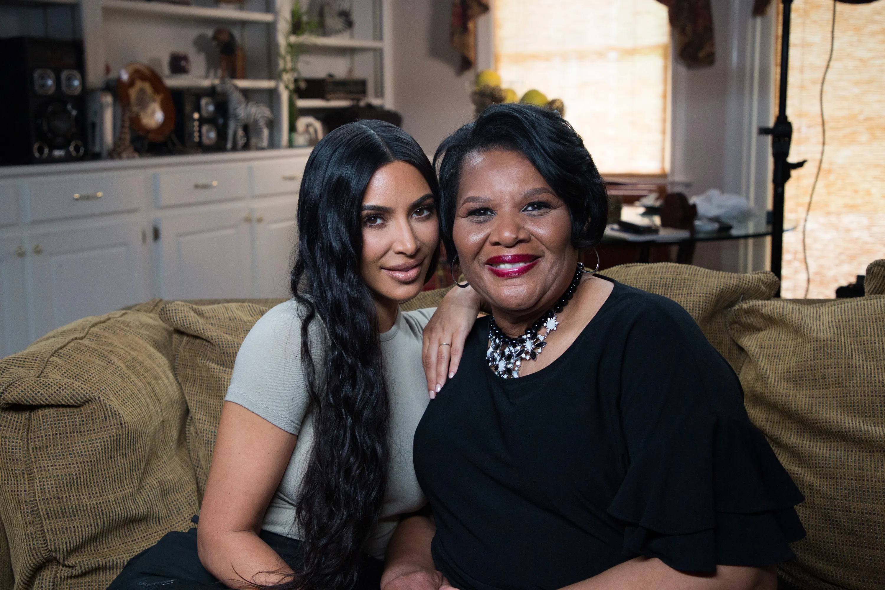 Kim Kardashian West and Alice Johnson smiling at the camera.