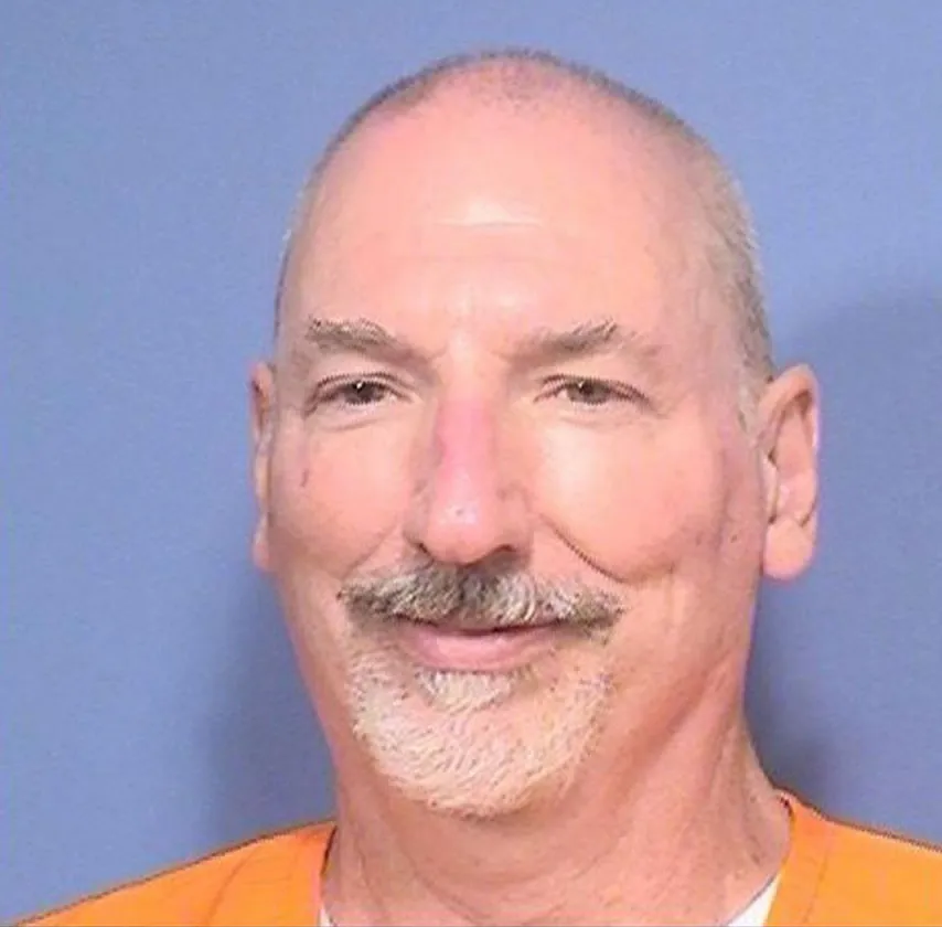 Mugshot of David Allen Funston, a bald white man with a gray mustache and goatee, wearing an orange prison uniform.