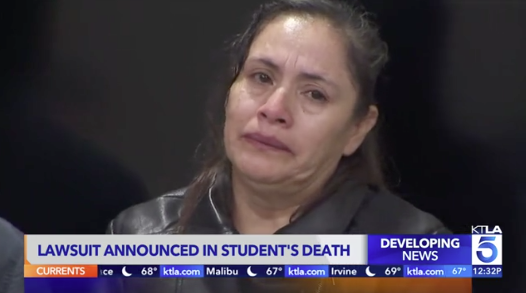 Woman crying, with news ticker reading 