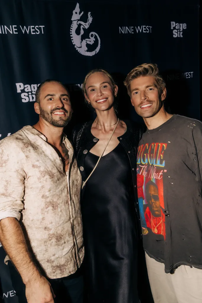 Kyle Cooke, Meghan King, and a third individual posing at the Page Six x Nine West event.