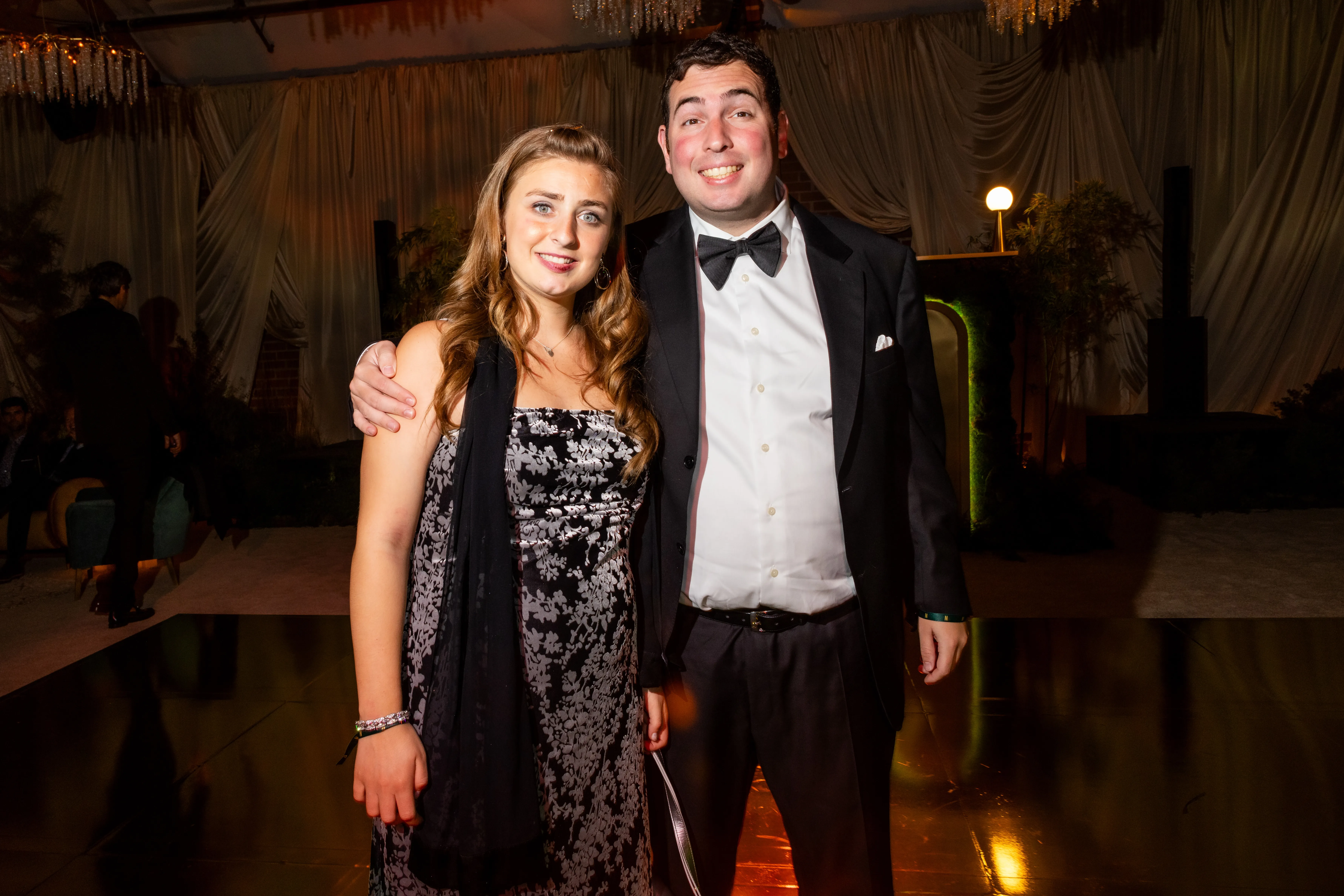 Abbey Romeo and David Isaacman pose for a photo.