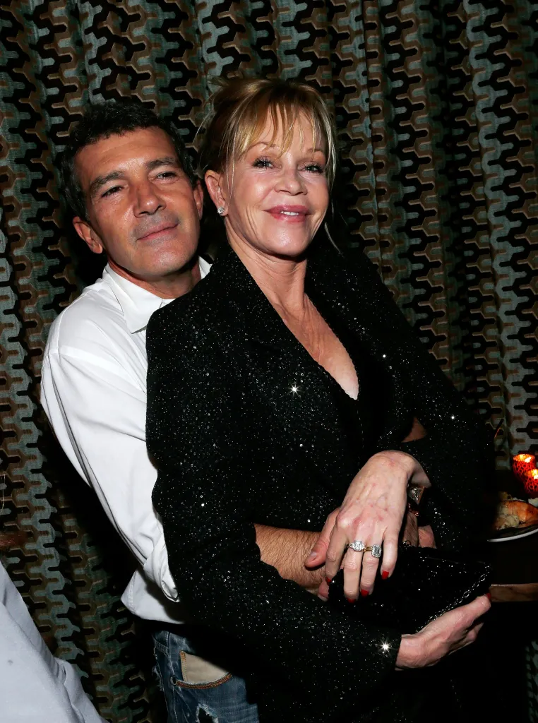 Antonio Banderas and Melanie Griffith embrace at an after-party.
