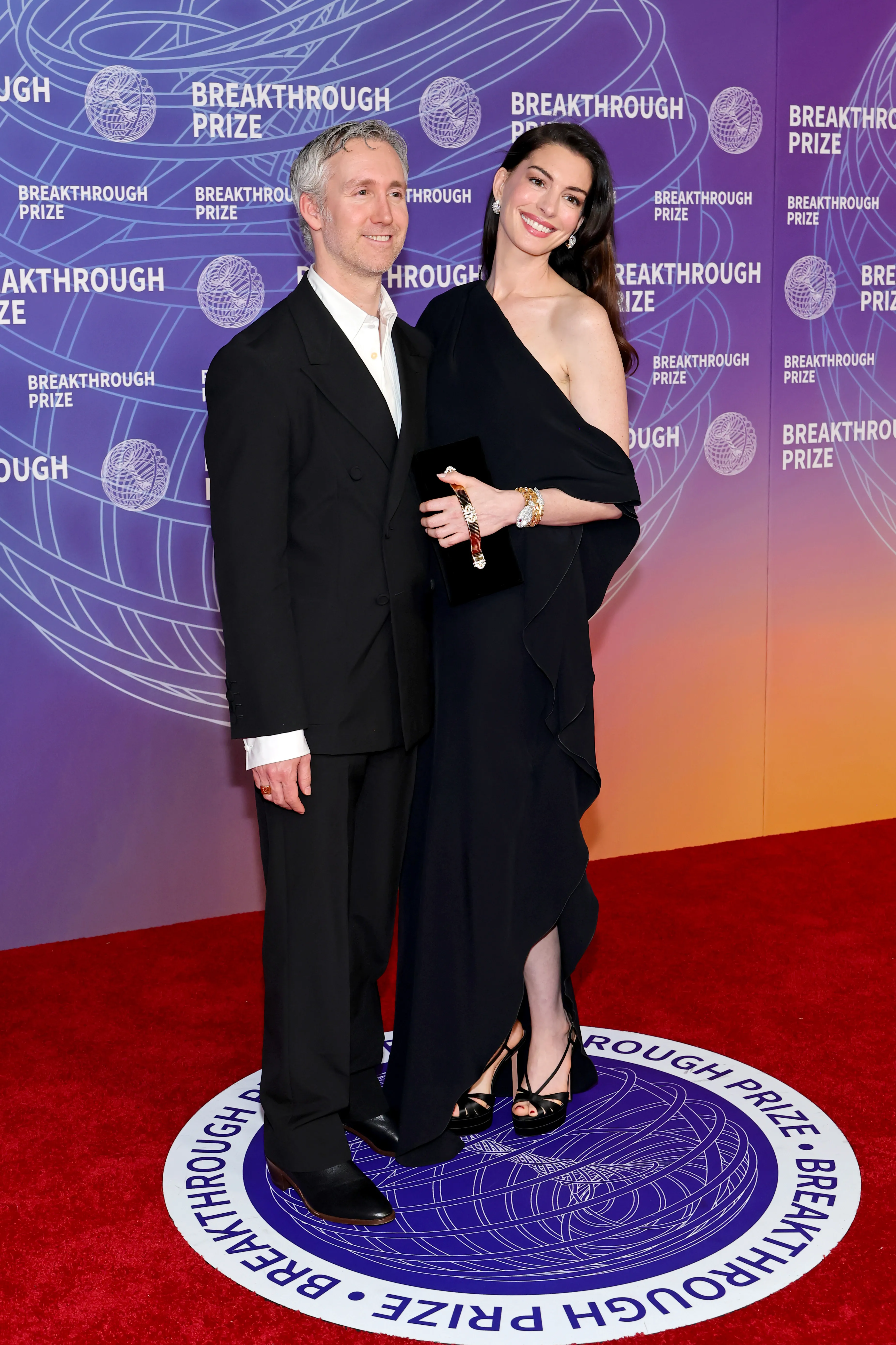 Adam Shulman and Anne Hathaway attend the 12th Breakthrough Prize Ceremony at Barker Hangar on April 18, 2026 in Santa Monica, Calif.