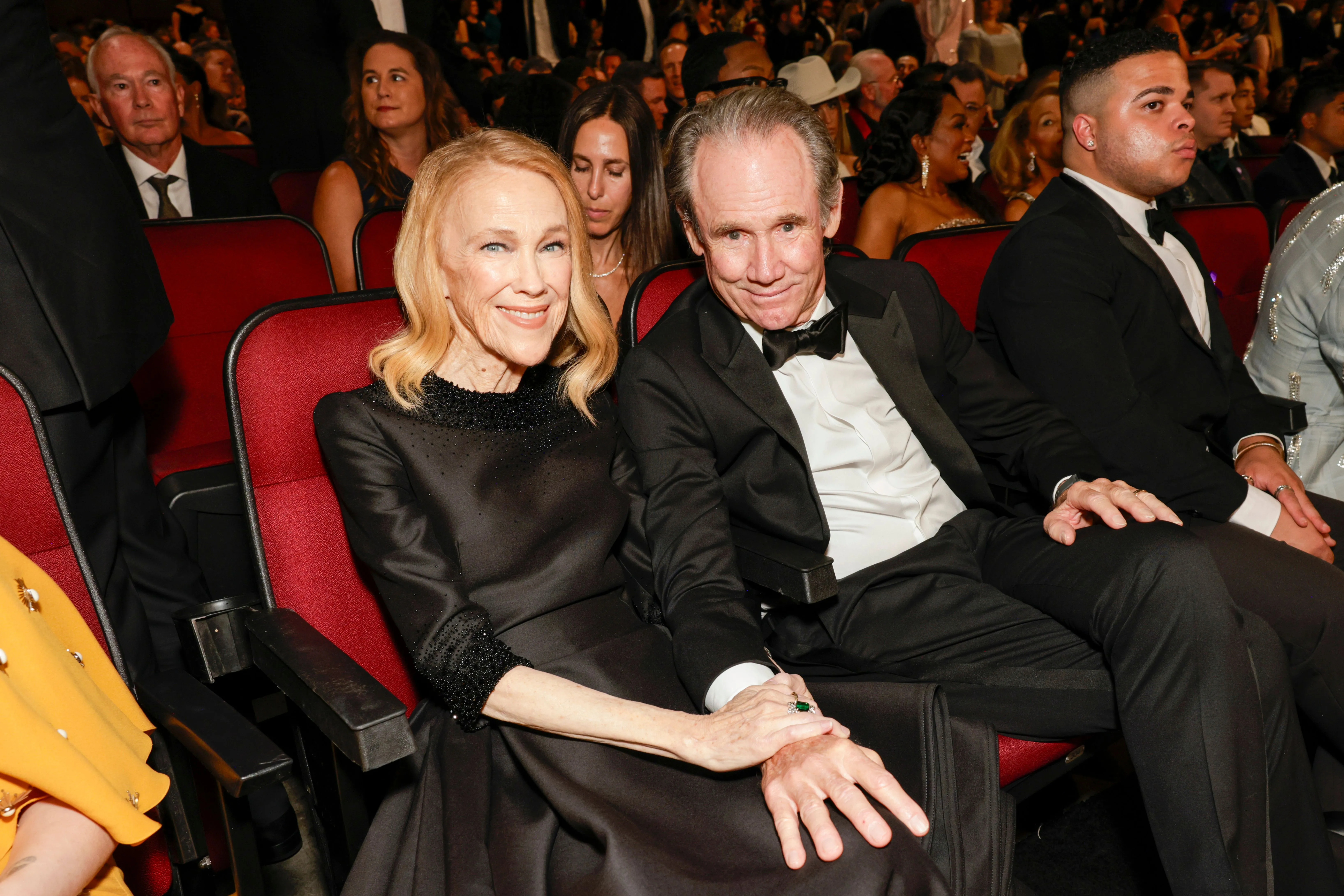 Catherine O'Hara and Bo Welch seated at the 77th Primetime Emmy Awards.