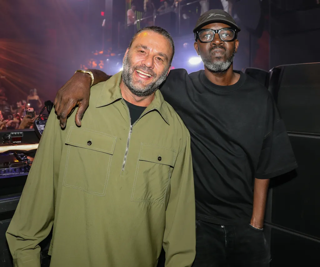 David Grutman and Black Coffee pose for a picture at LIV Nightclub.
