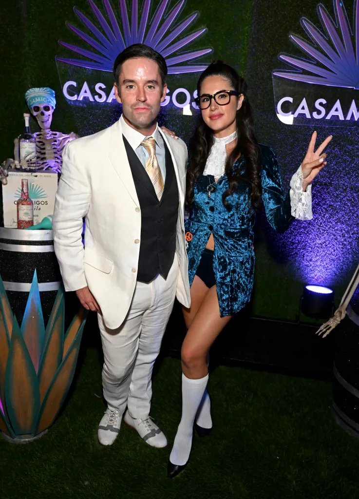 Jesse Lally and Michelle Saniei Lally posing at the Casamigos Halloween Party.