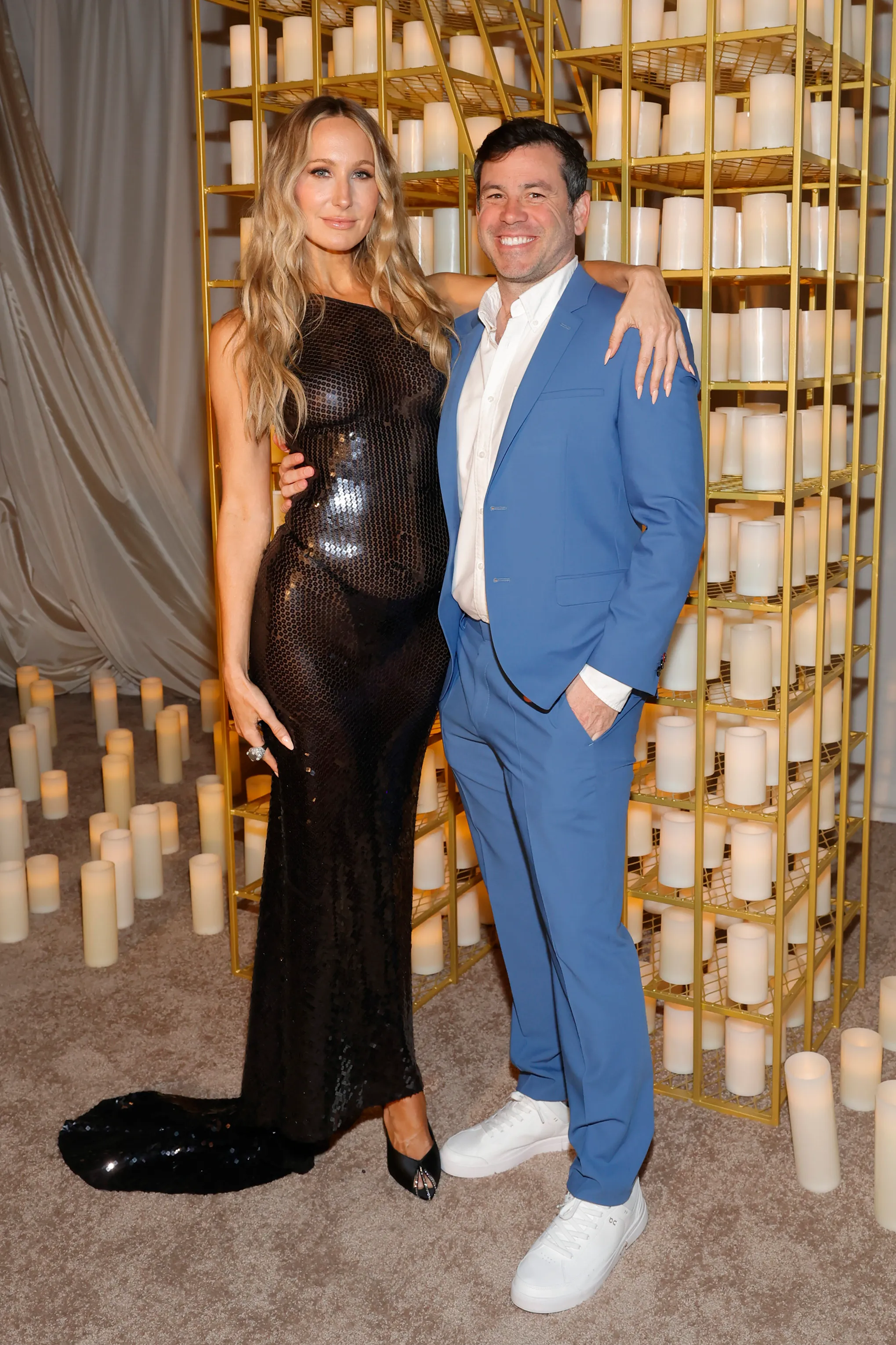 Nikki Glaser and Chris Convy posing at an event.
