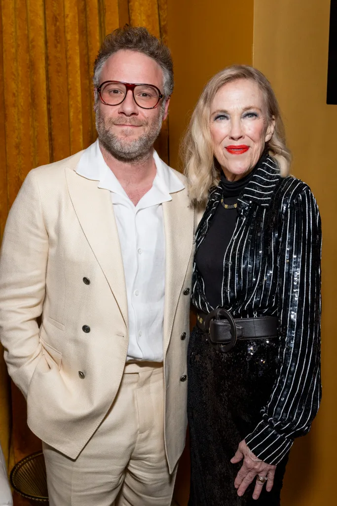 Seth Rogen in a cream suit next to Catherine O'Hara in a sequined jacket, at 