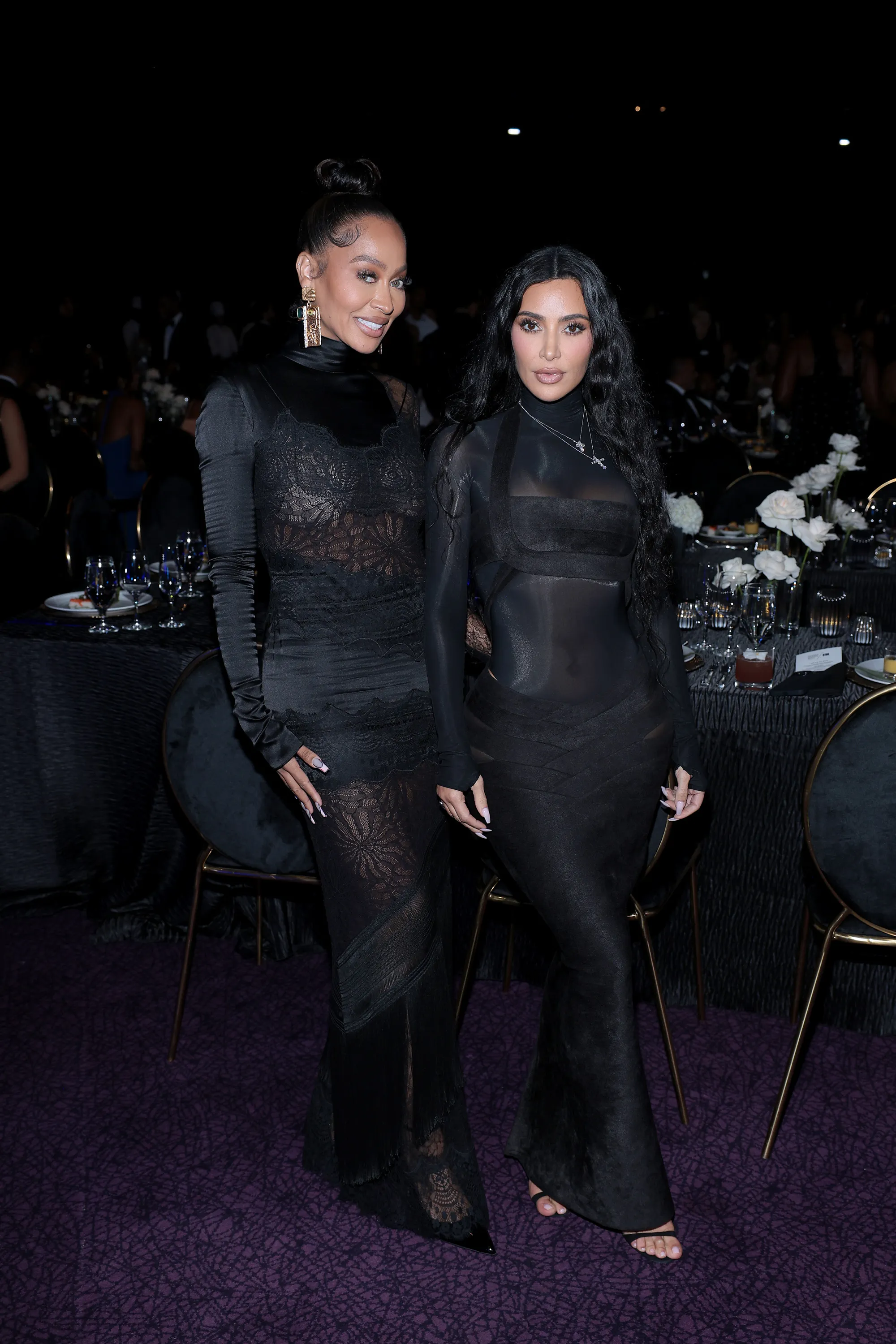 LaLa Anthony and Kim Kardashian pose at the REFORM Alliance Casino Night Event.
