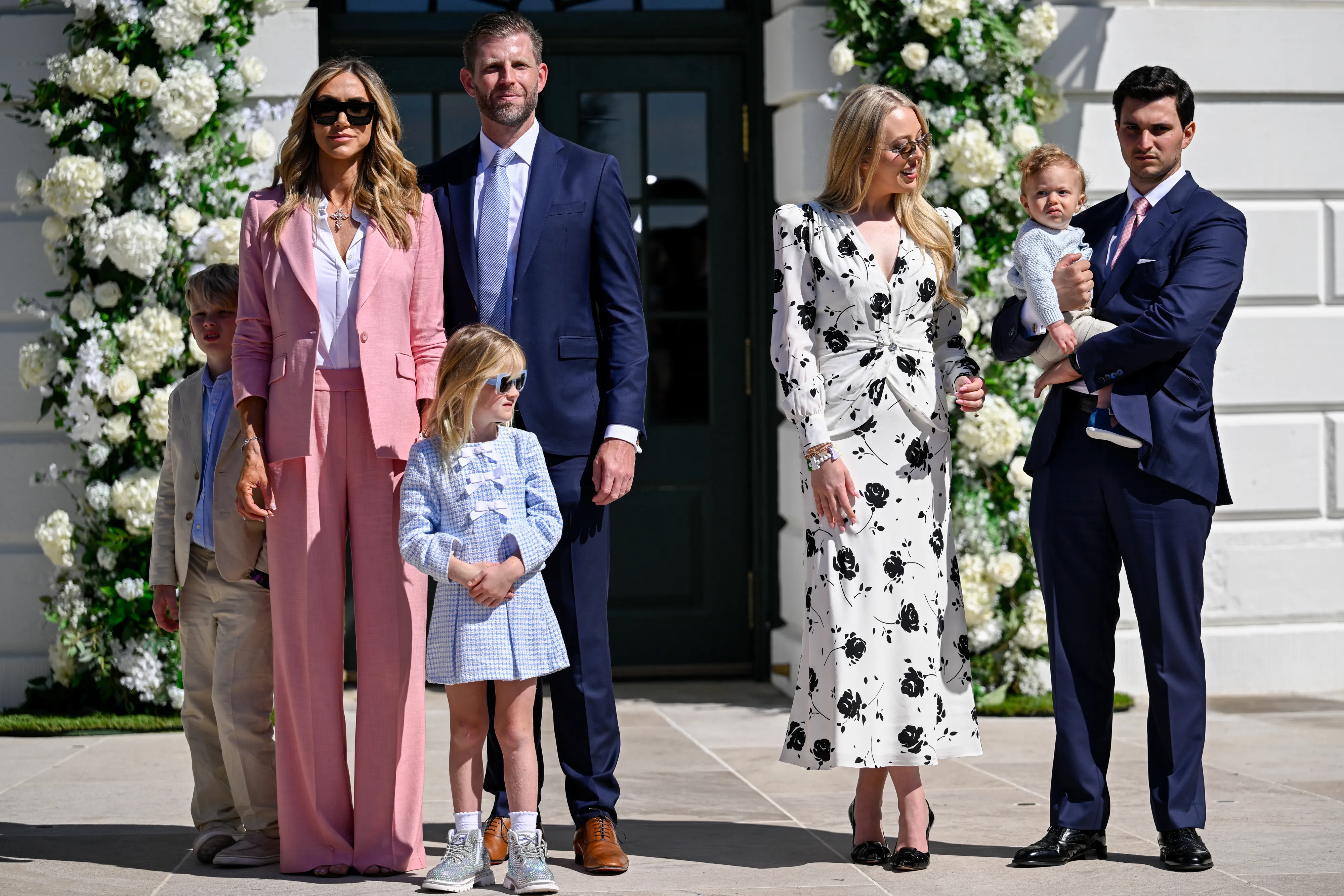 Lara Trump, Eric Trump, Tiffany Trump, and Michael Boulos with two children and a baby at the White House Easter Egg Roll.