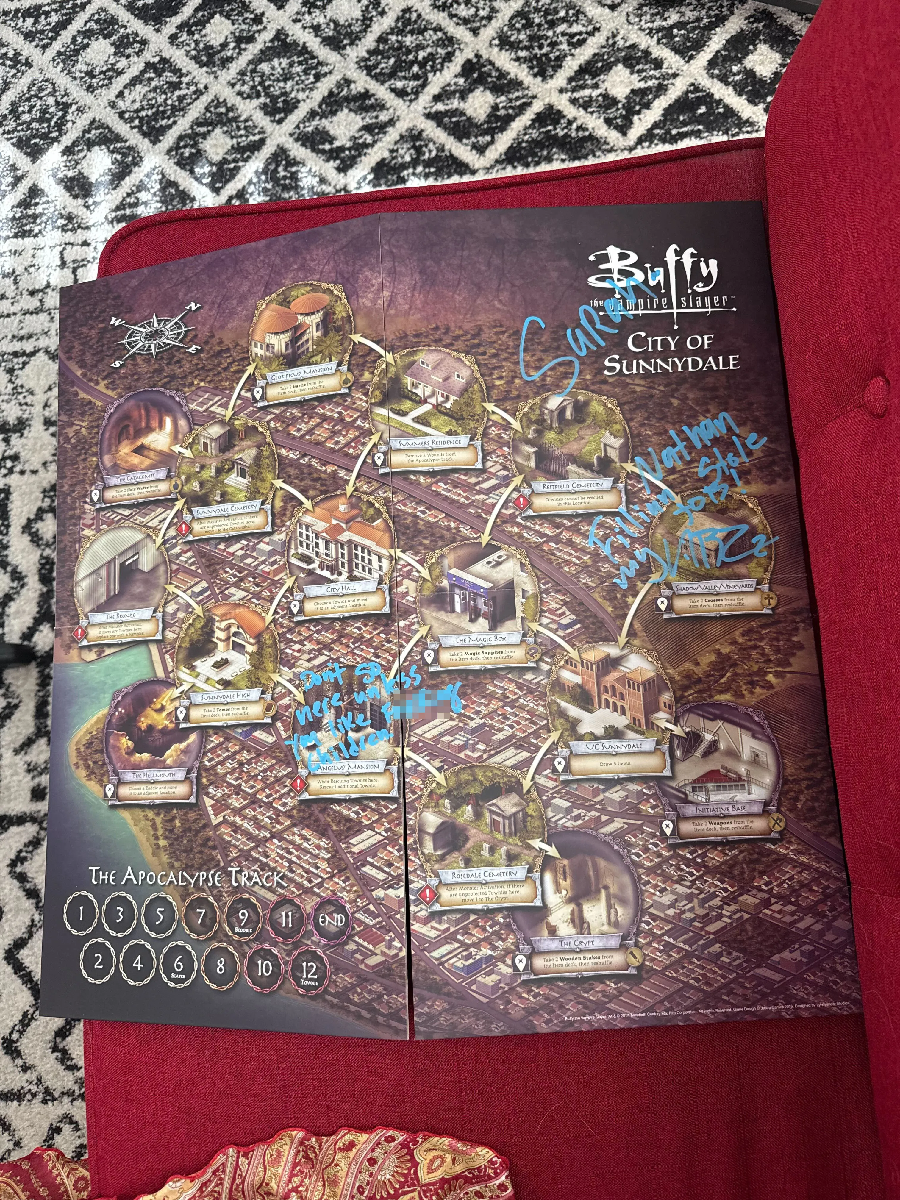 A Buffy the Vampire Slayer board game map of the City of Sunnydale, with handwritten blue ink scribbles across the board.
