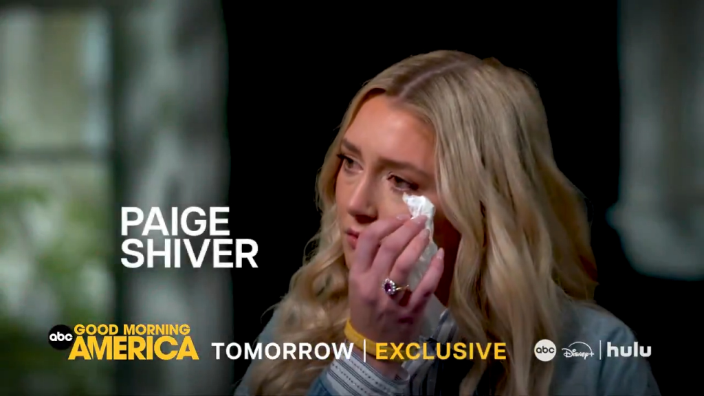 Paige Shiver cries while wiping her eye with a tissue.