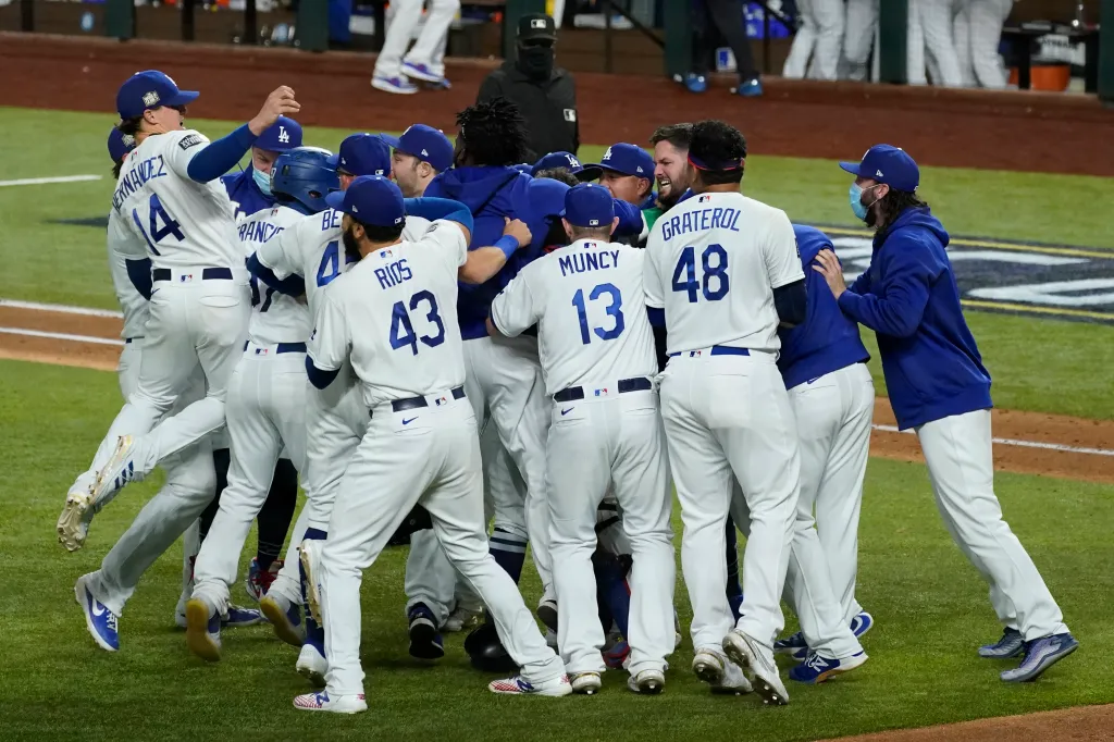 Los Angeles Dodgers players celebrate after winning the World Series.