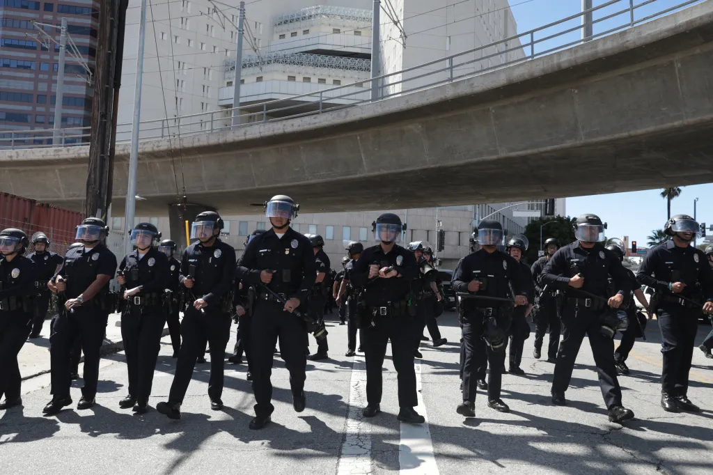 Los Angeles Police Department officers in riot gear during an anti-ICE protest.