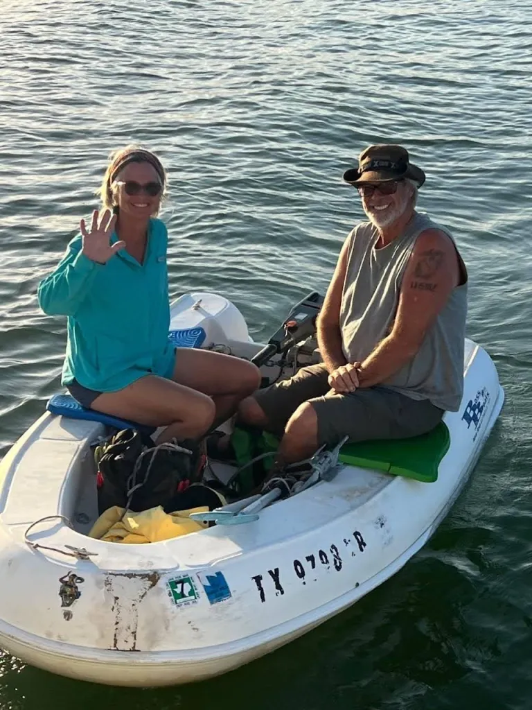 Lynette and Brian Hooker in a small white boat.