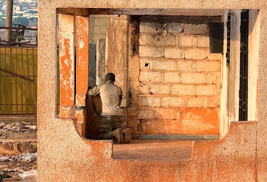 A Malian soldier stands in position with his weapon during an attack on Mali's main military base Kati on April 25, 2026.