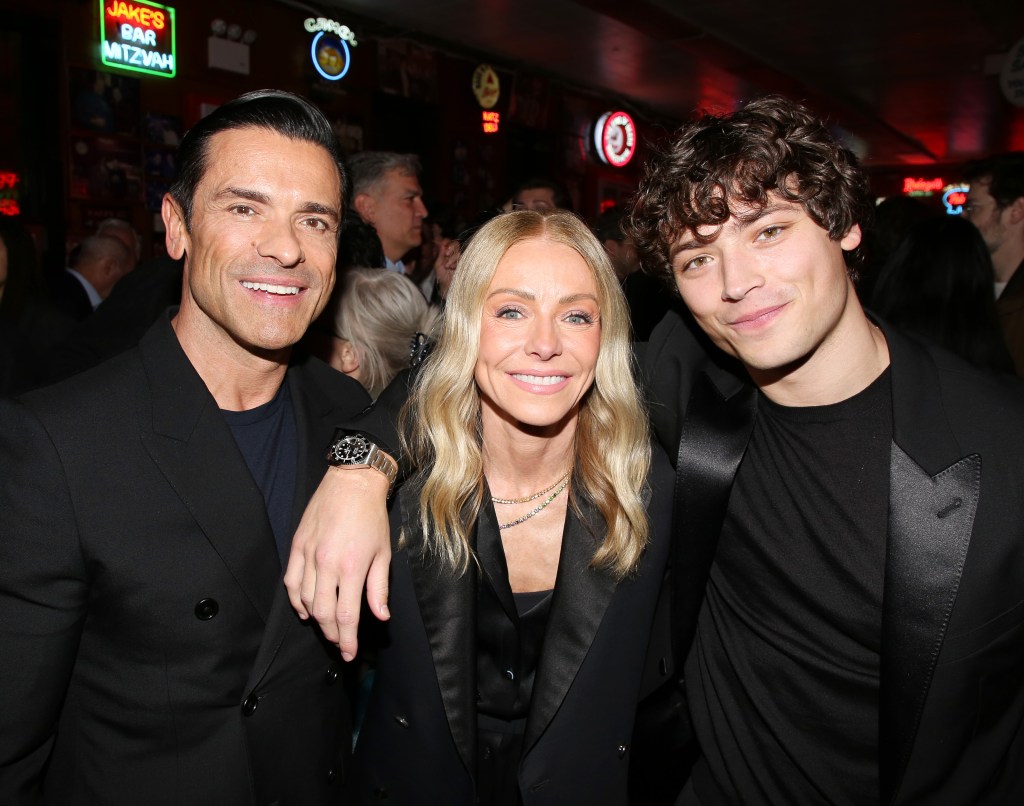 Mark Consuelos, Kelly Ripa, and Joaquin Consuelos smiling at the opening night after party for "Death of a Salesman" on Broadway.