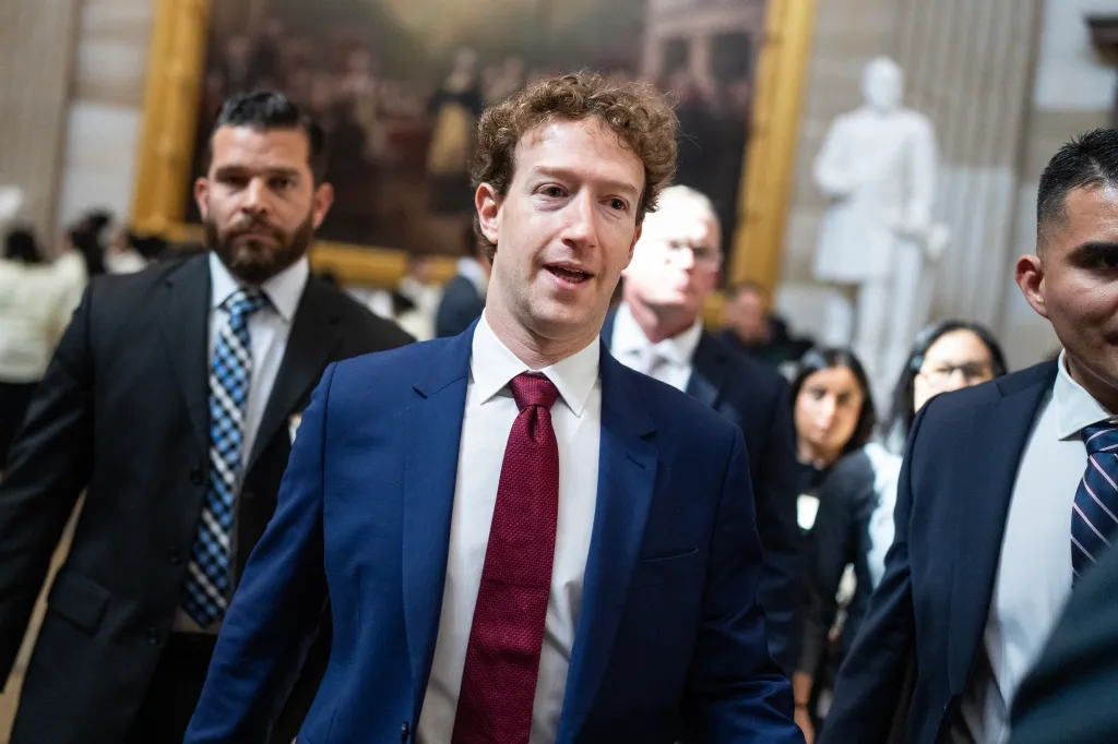 Mark Zuckerberg, CEO of Meta, speaks while walking in the U.S. Capitol.