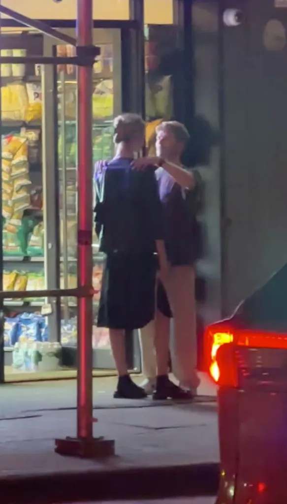 Meghan King Edmonds and Kyle Cooke embracing at night.