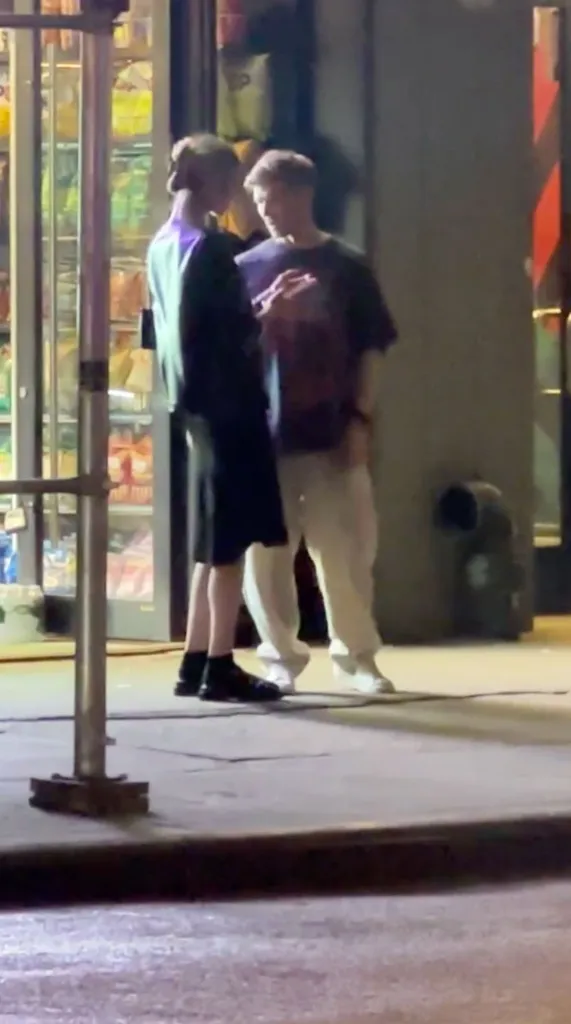 Meghan King Edmonds and Kyle Cooke talking outside a store.