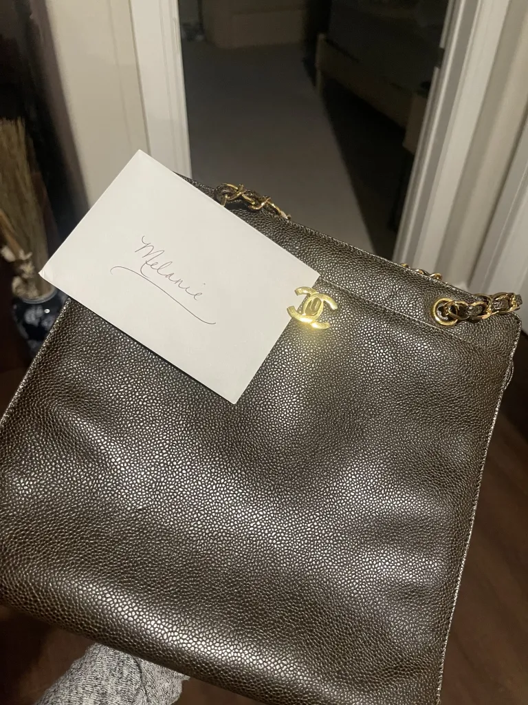 Melanie Moon's vintage designer bag with a note that reads 
