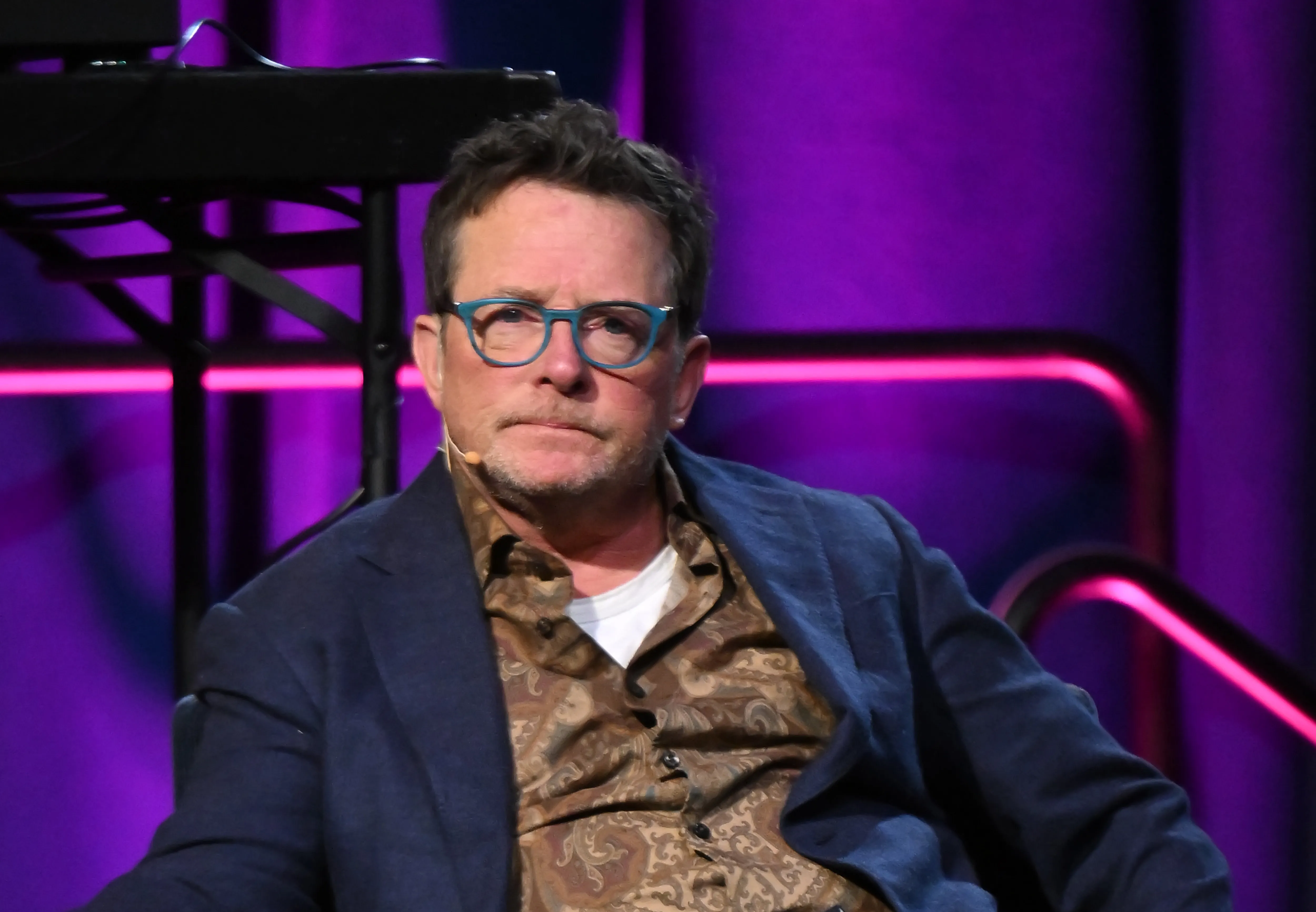Michael J. Fox speaks onstage.