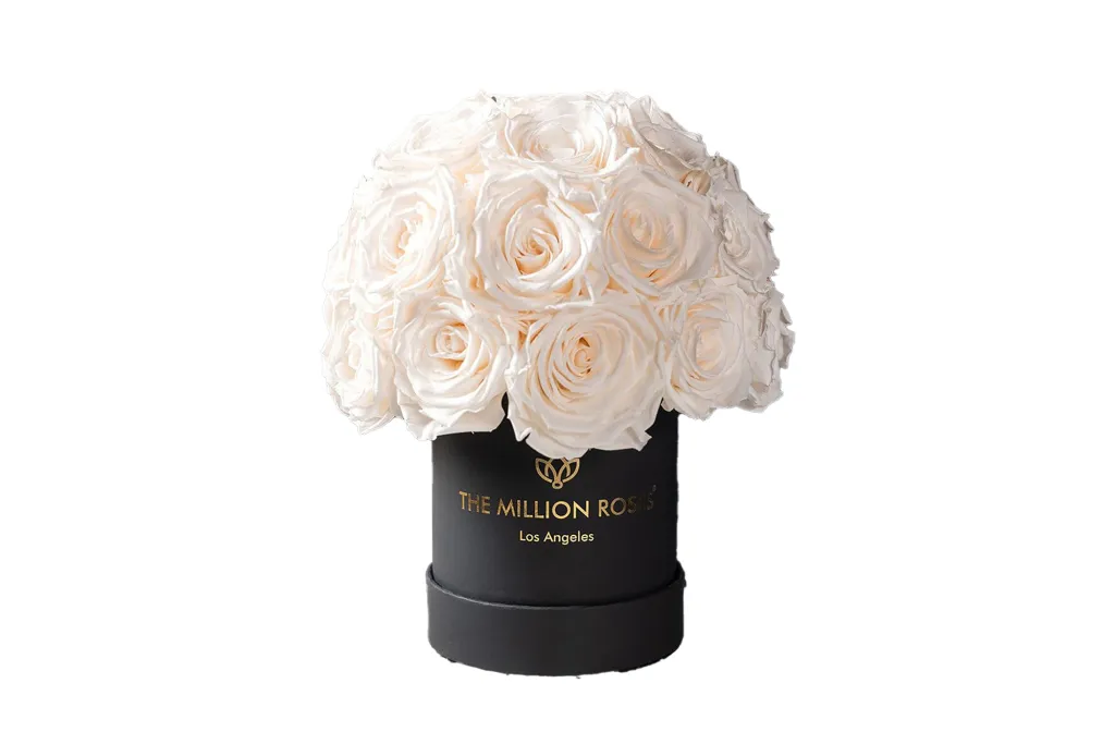 Black box filled with white roses from The Million Roses.