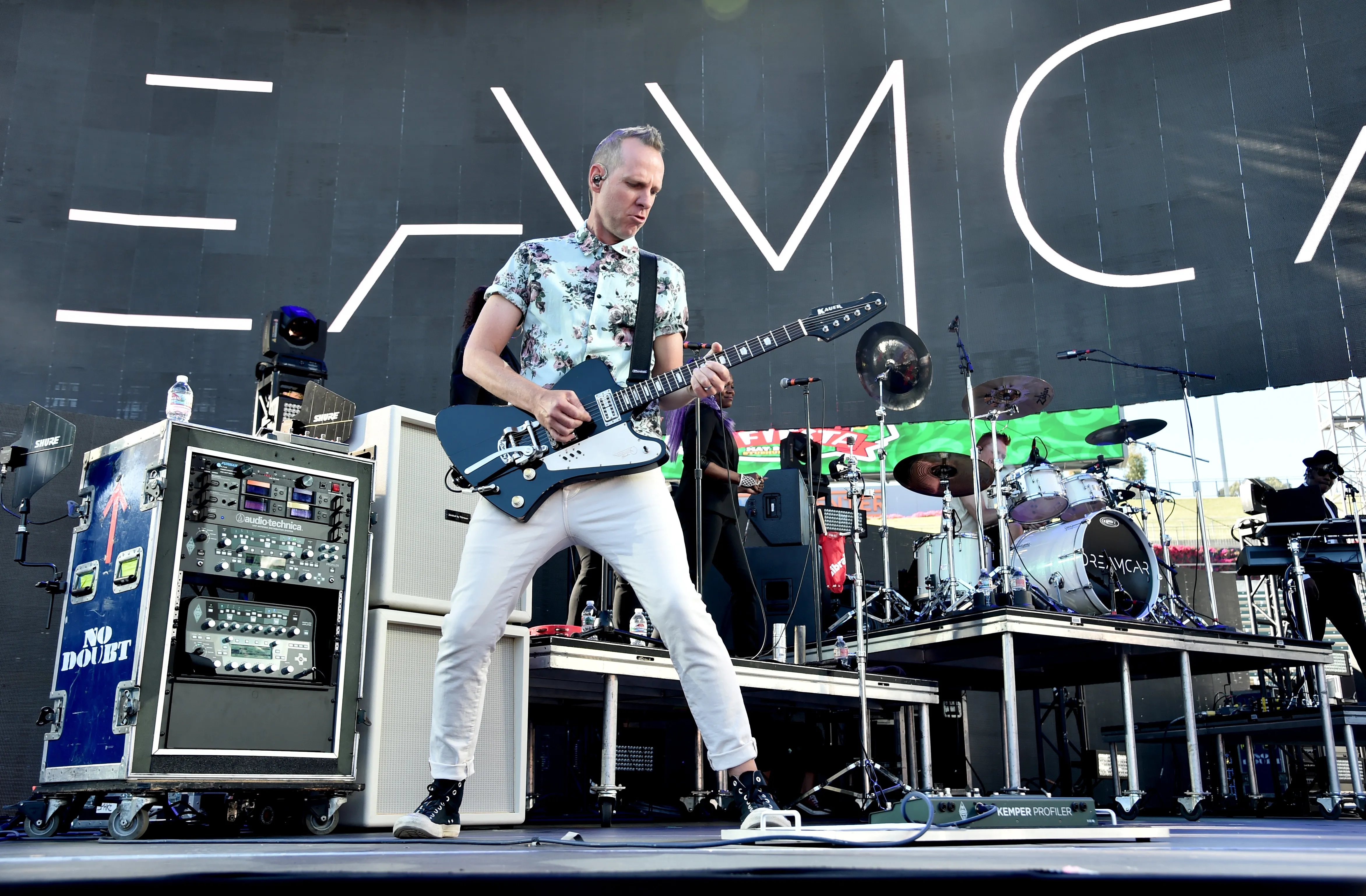 Tom Dumont of Dreamcar playing guitar on stage.