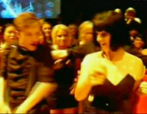 Katy Perry and Ruby Rose dancing at a school prom.