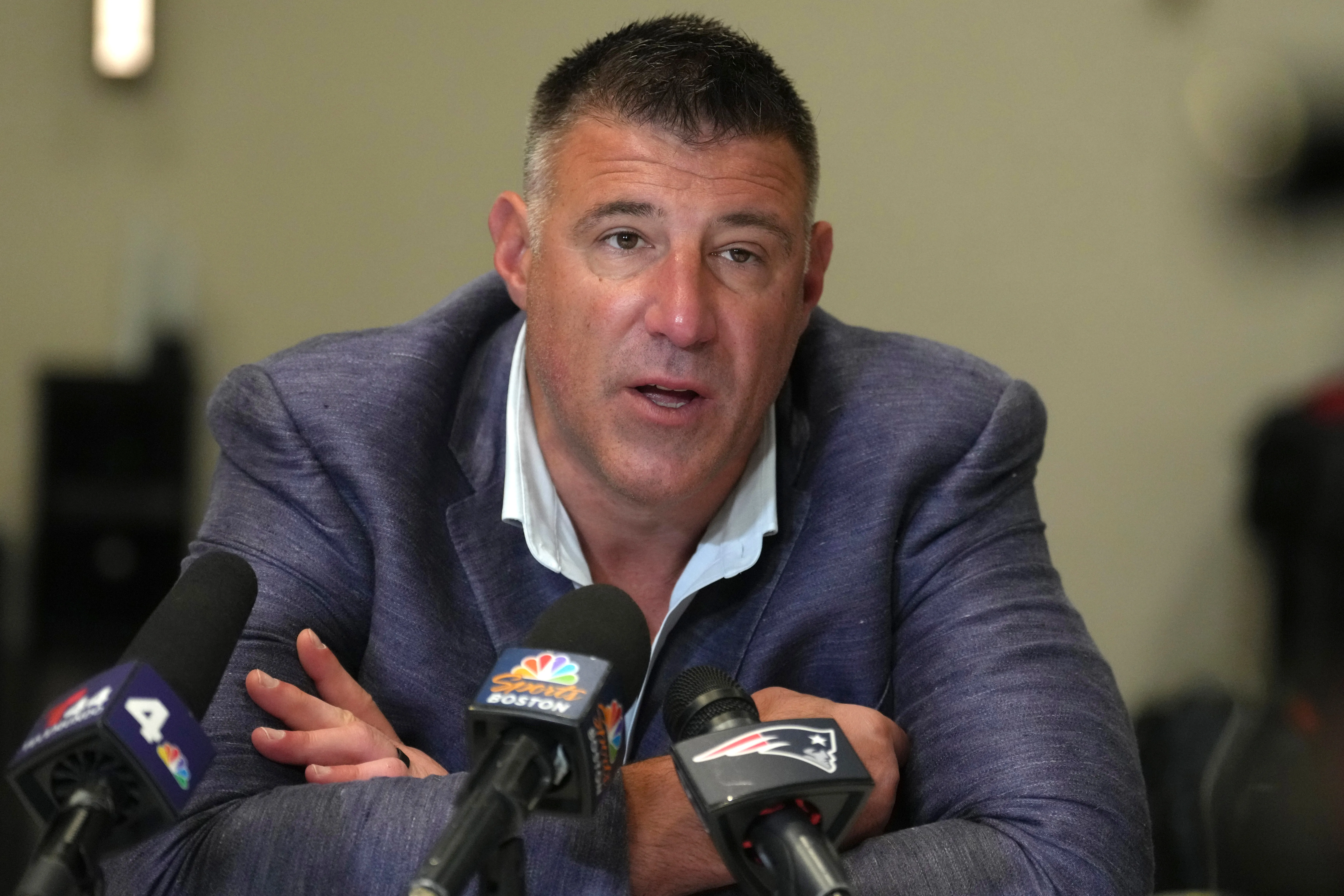 New England Patriots head coach Mike Vrabel speaks to reporters at the NFL annual meetings.