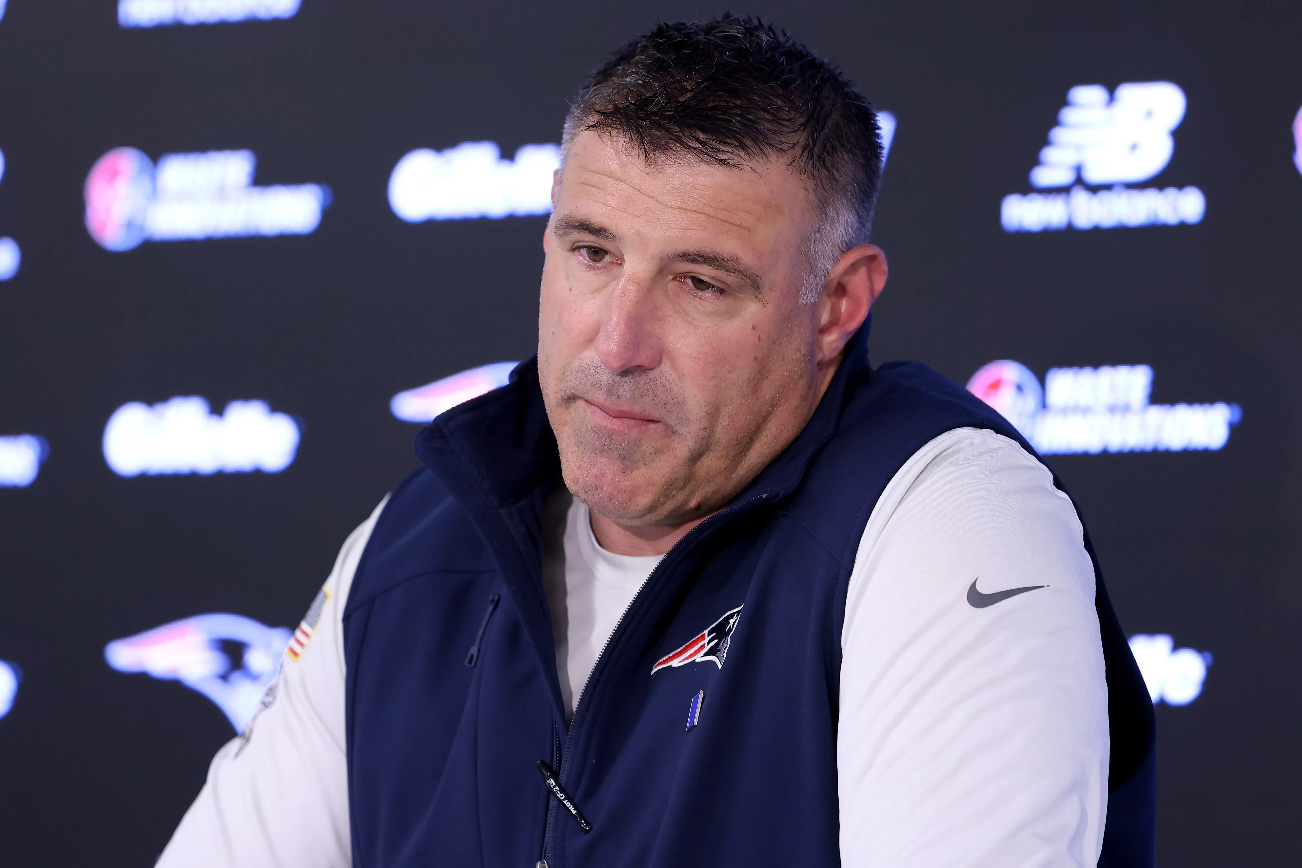 New England Patriots head coach Mike Vrabel speaking at a press conference.
