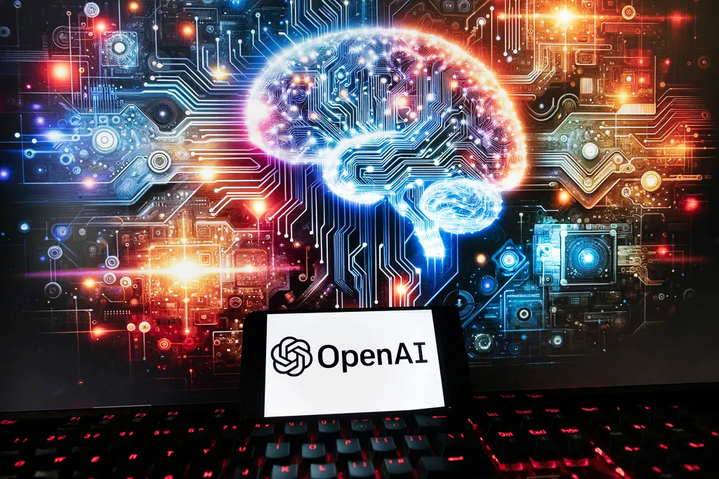 A phone displaying the OpenAI logo and text sits on a keyboard, with a circuit board illustration featuring a glowing brain in the background.