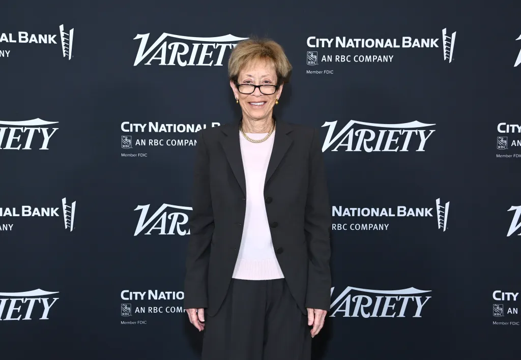 Patricia L. Glaser, Partner and Chair of Litigation Department at Glaser Weil, smiling in a black suit and light pink shirt in front of a backdrop with "Variety" and "City National Bank" logos.