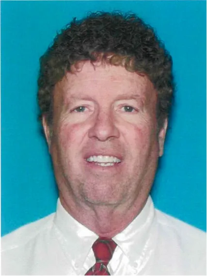 Paul Richard Randall, 66, smiling against a blue background.