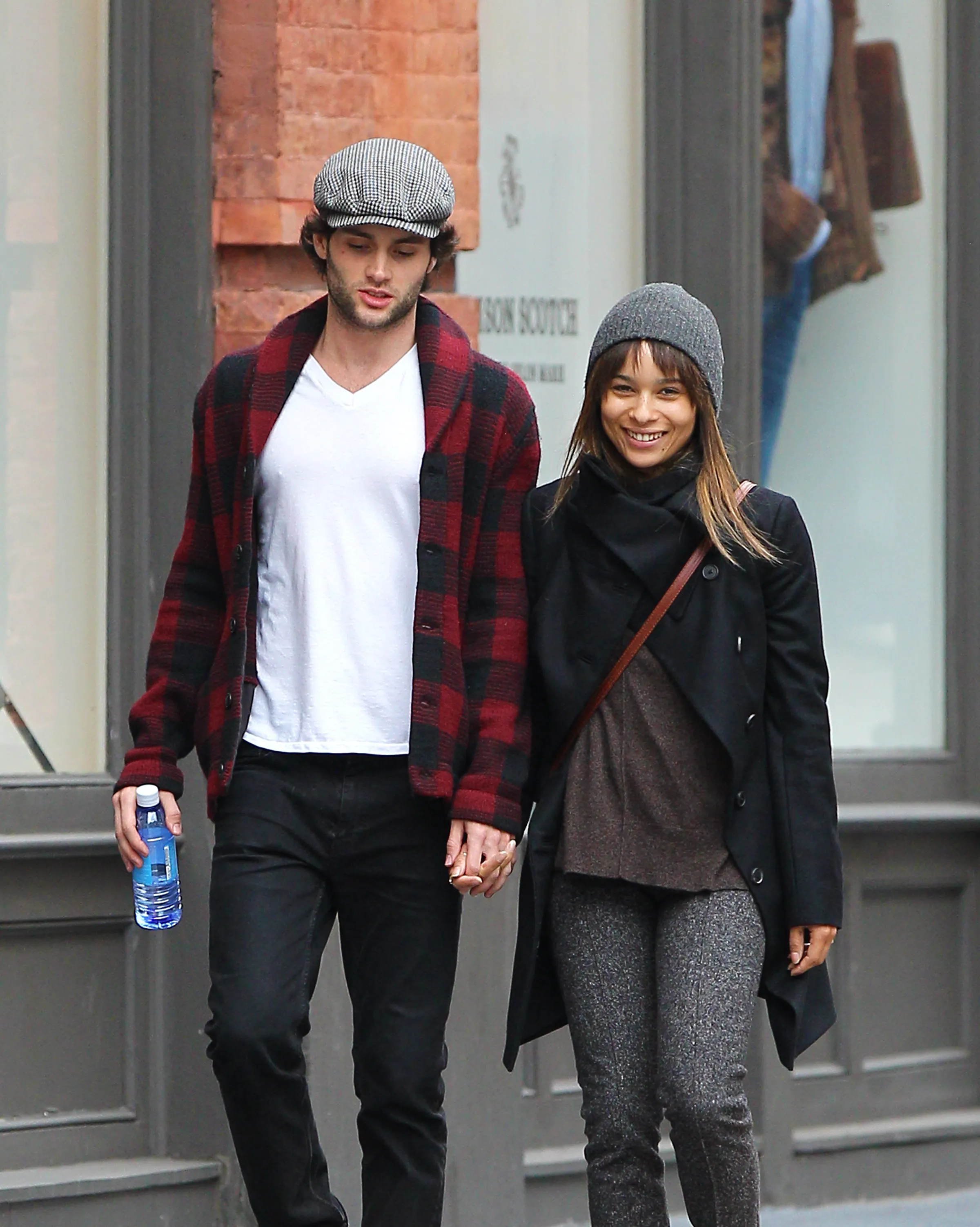 Penn Badgley and Zoe Kravitz walking hand-in-hand in NYC.