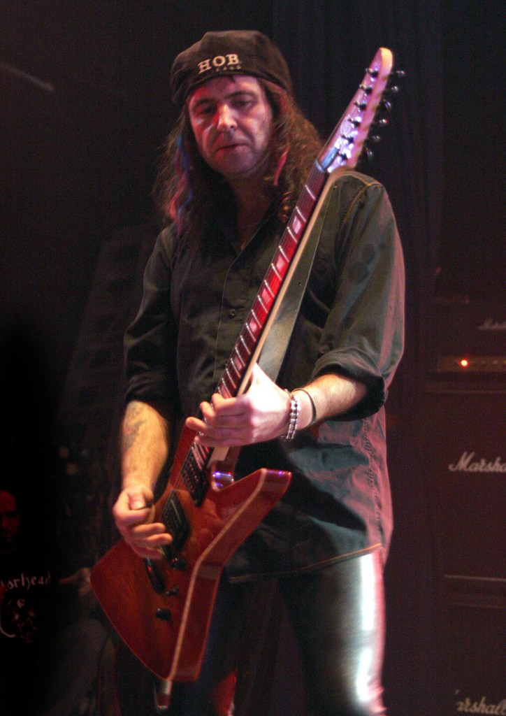 Phil Campbell of Motorhead performing on stage.