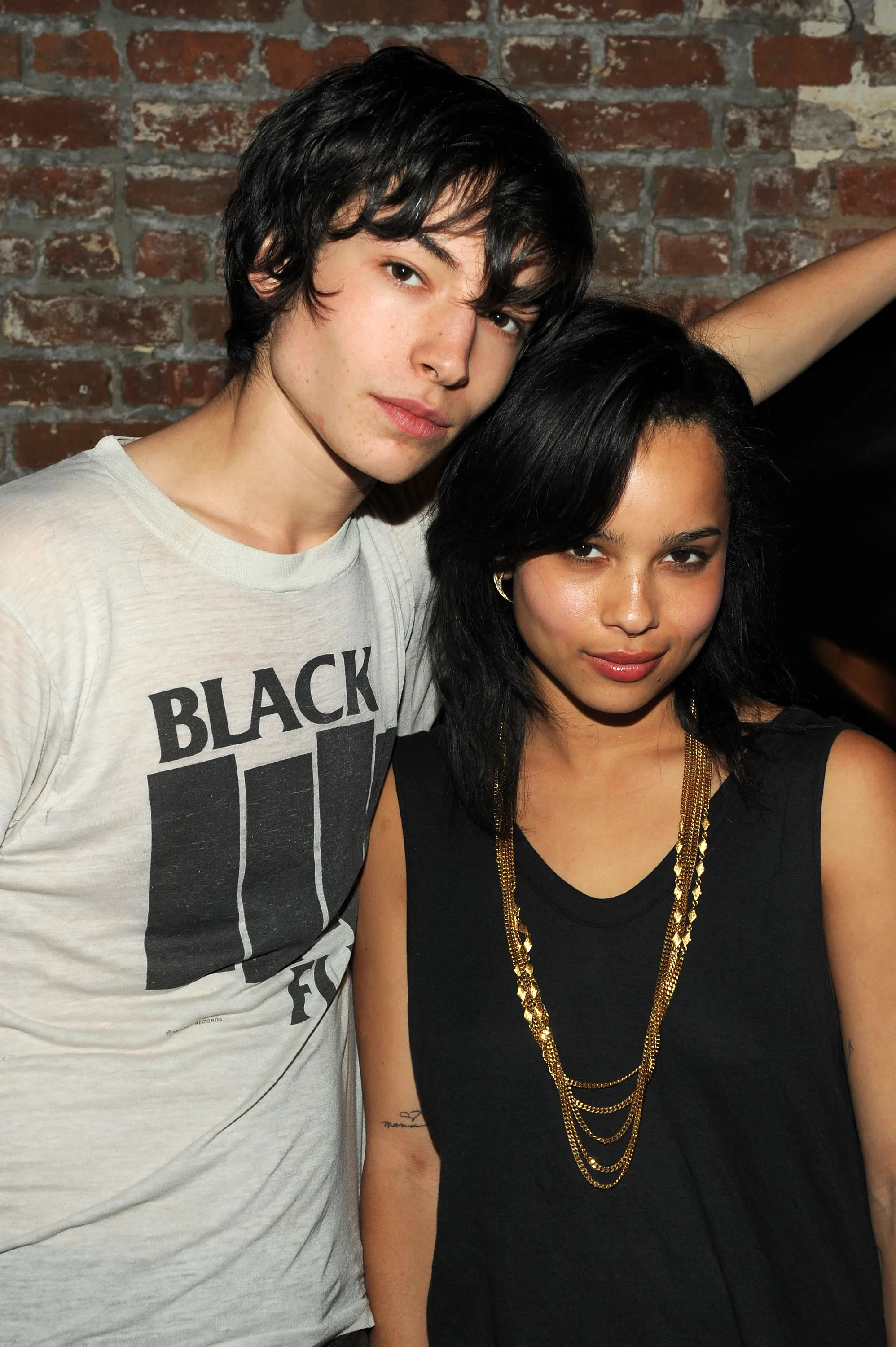 Actors Ezra Miller and Zoë Kravitz pose at the "Every Day" after party.