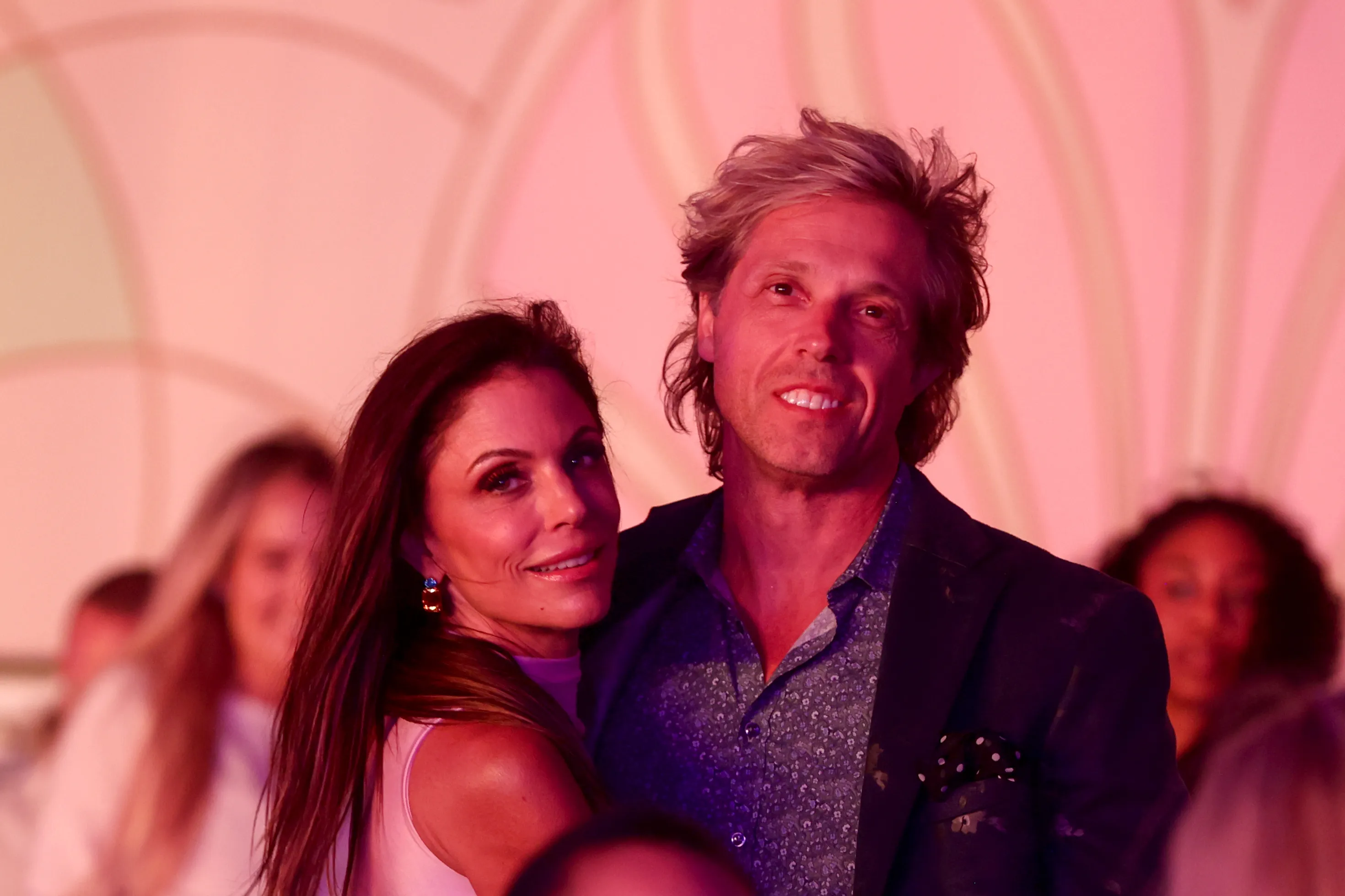 Bethenny Frankel and a man smiling together.