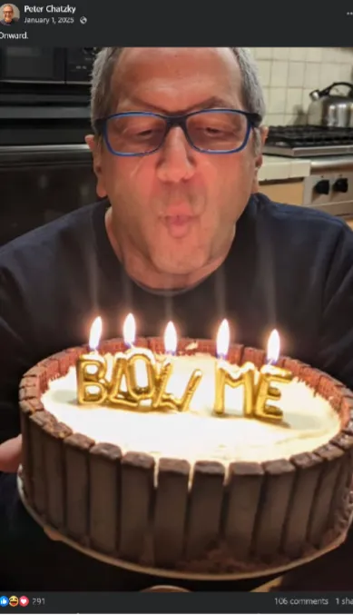 Peter Chatzky blowing out birthday candles that spell "BLOW ME" on a cake.