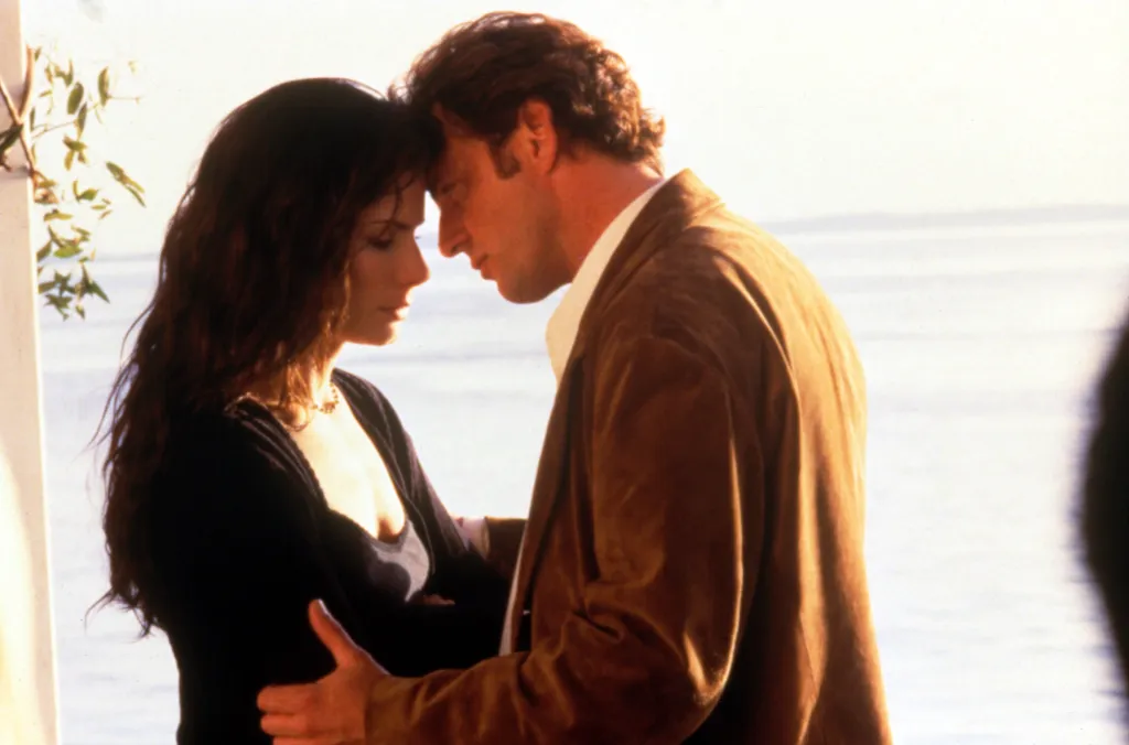 Sandra Bullock and Aidan Quinn in a romantic embrace from the movie "Practical Magic".