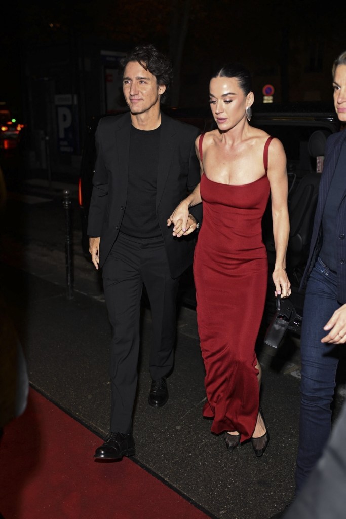 Katy Perry and Justin Trudeau holding hands at her 41st birthday celebration.
