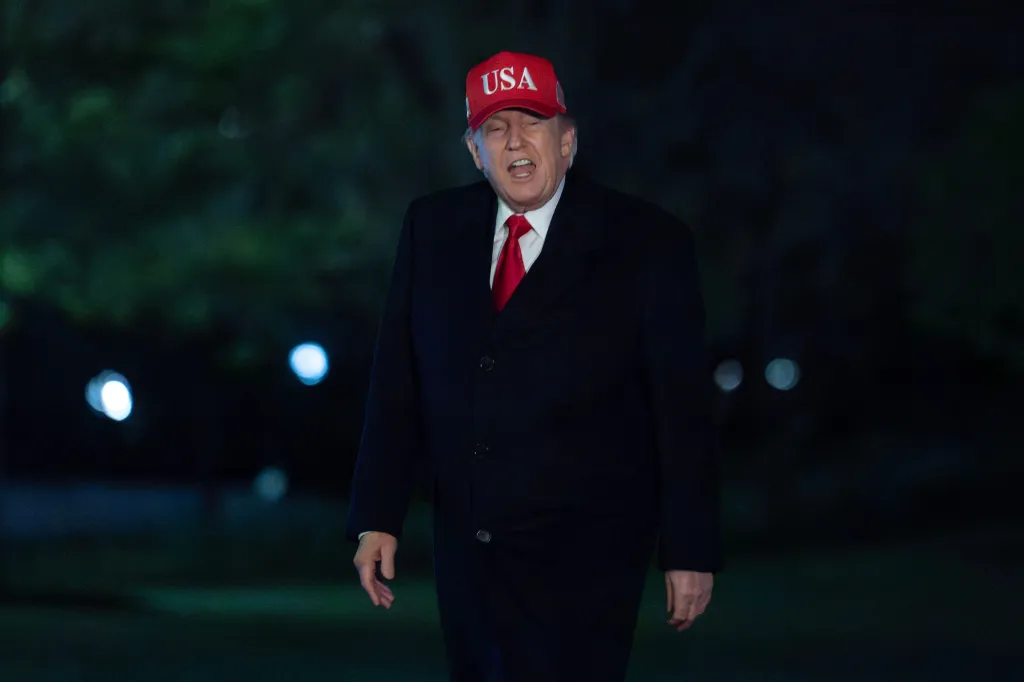 President Donald Trump talks to reporters as he walks on the South Lawn upon his arrival to the White House, Sunday, April 12, 2026, in Washington. (AP Photo/Jose Luis Magana)