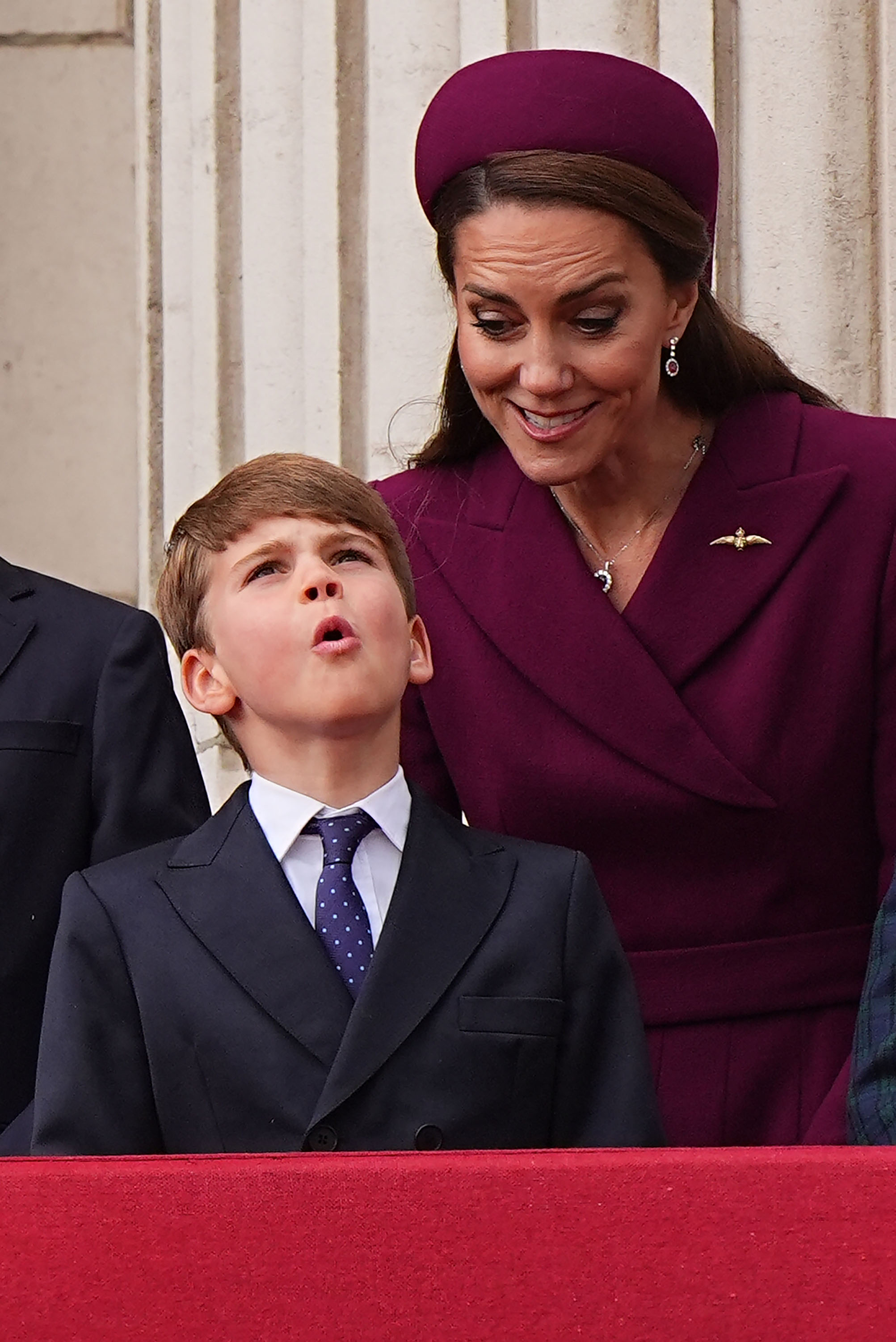 Prince Louis and Catherine, Princess of Wales, on the balcony of Buckingham Palace.